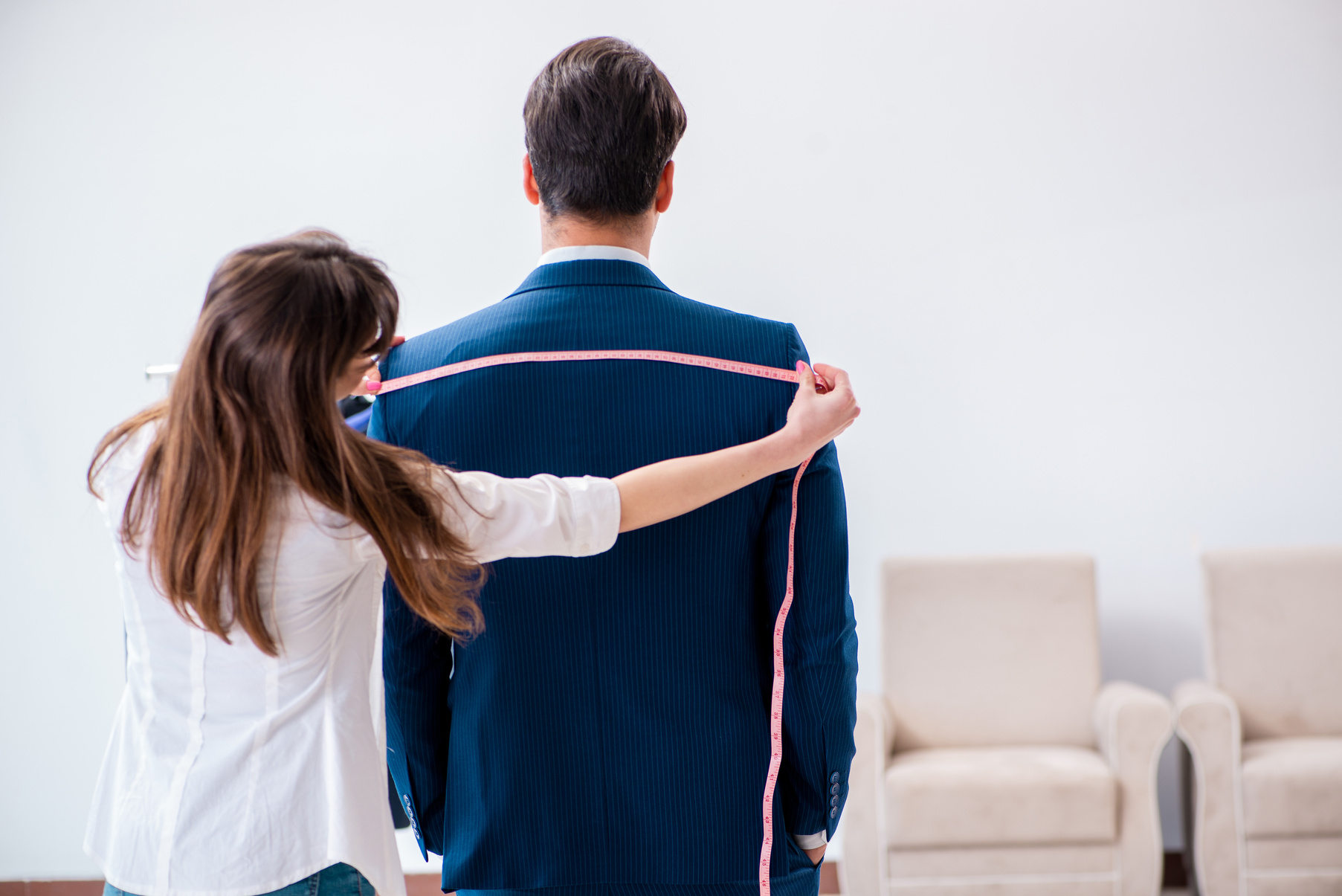 Tailor Taking Measurements 